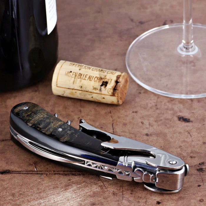 Laguiole Magnum Buffalo Bark Corkscrew, close-up of dark bark handle and polished steel.