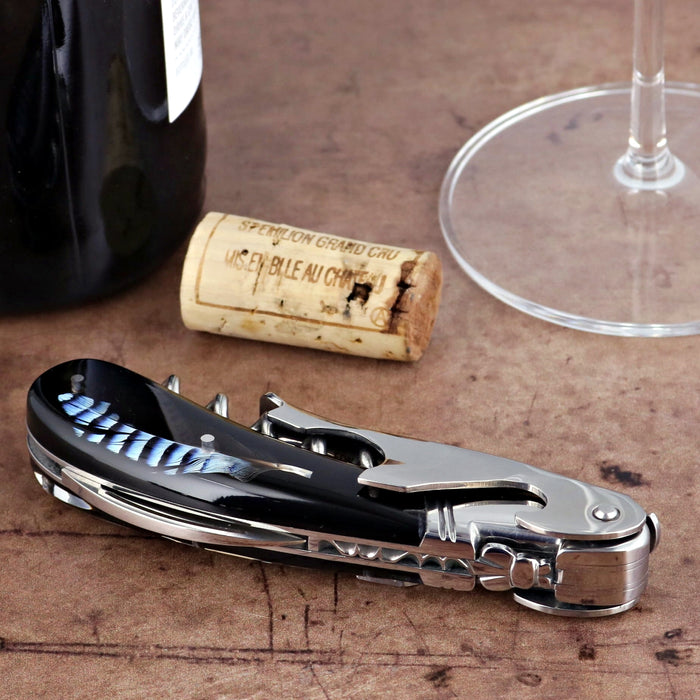 Laguiole Magnum Corkscrew, close-up of black handle with blue feather inlay and polished stainless steel.
