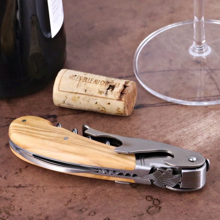 Laguiole Magnum Corkscrew Deco Woodcock - Olive Wood, close-up of handle with woodcock emblem.