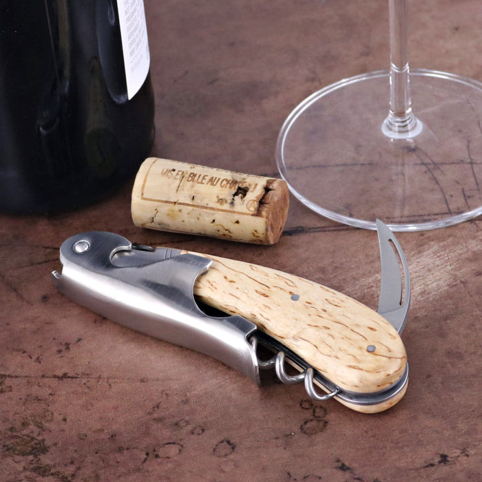 Laguiole Magnum Karelian Birch Corkscrew, close-up of light wood handle and stainless steel body.
