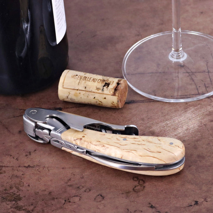 Laguiole Magnum Karelian Birch Corkscrew, close-up of light wood handle with metal accents.