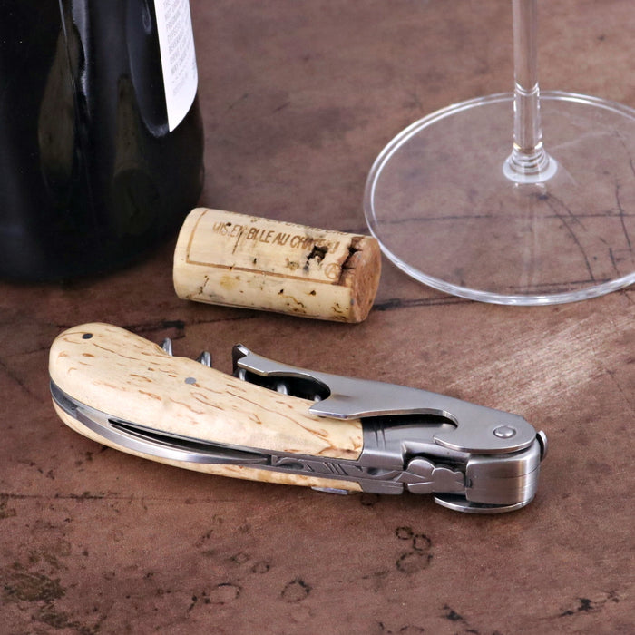 Laguiole Magnum Karelian Birch Corkscrew, close-up of light wood handle and stainless steel tools.