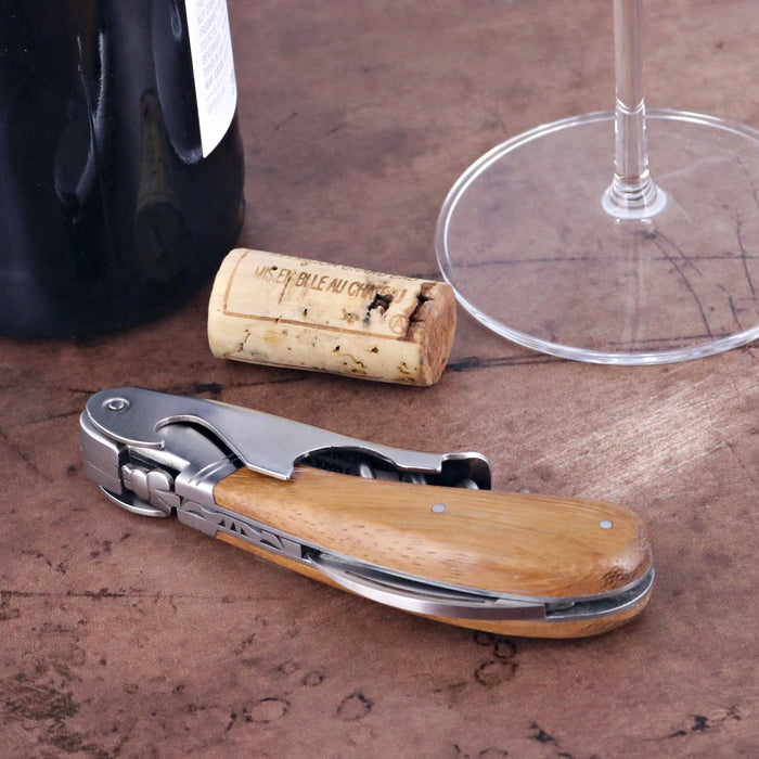 Laguiole Magnum Mahogany Corkscrew, close-up of light wood handle and stainless steel tools.