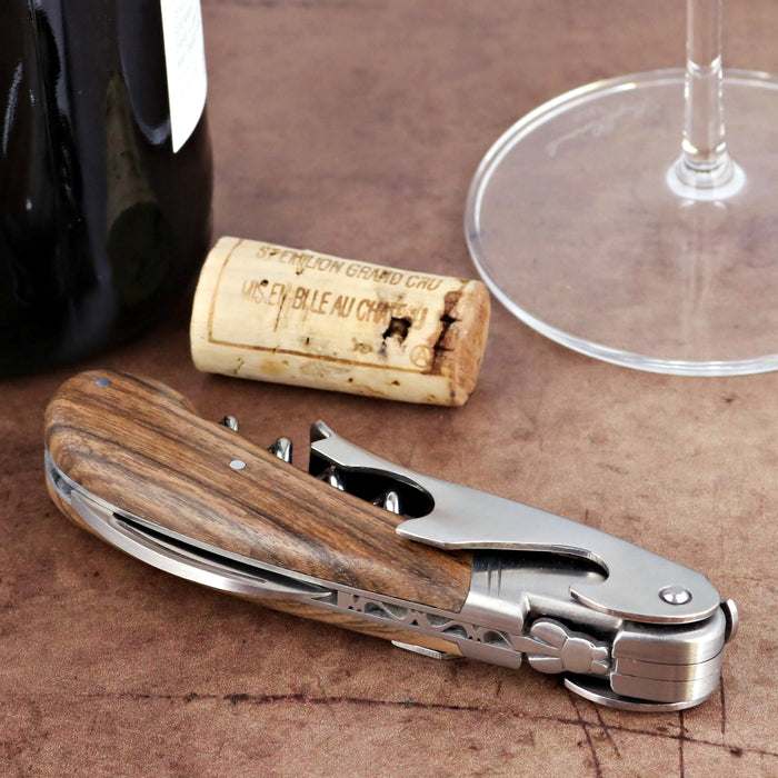 Laguiole Magnum Walnut Corkscrew, close-up of wood handle and silver metal tools.