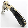 Magnum Cold Forged Brass Corkscrew - Studded Ebony, close-up of handle with brass and silver accents.