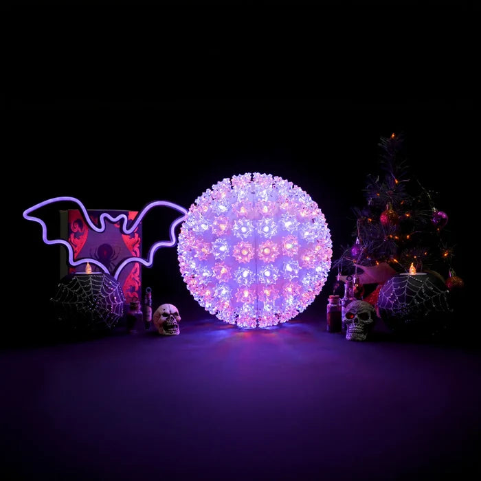 Decorative light ball with Halloween-themed props on a dark background