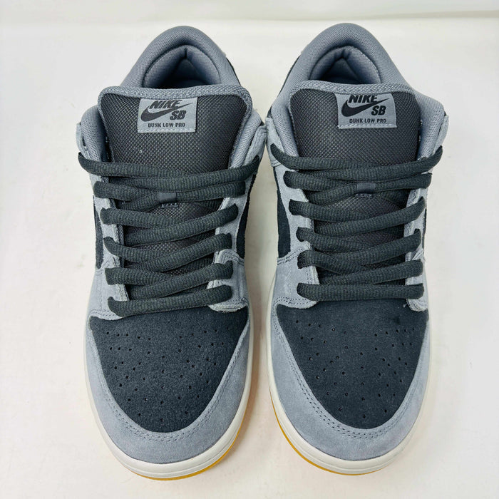 Introducing the Nike SB Dunk Low Dark Smoke Grey sneakers, featuring a gray and black design with a mustard sole. Packaged in a signature purple box with extra black laces, these 100% authentic sneakers ensure your style stays fresh and versatile.