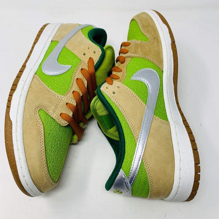 Nike SB Dunk Low Escargot sneakers in beige, green, and silver accents, featuring orange laces.