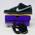 Nike SB Dunk Low Fog black sneaker with gray swoosh, yellow sole, extra black laces, and purple box from 2021