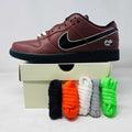 Nike SB Dunk Low Limosine skate shoe in maroon with black swoosh and multiple colorful laces on box