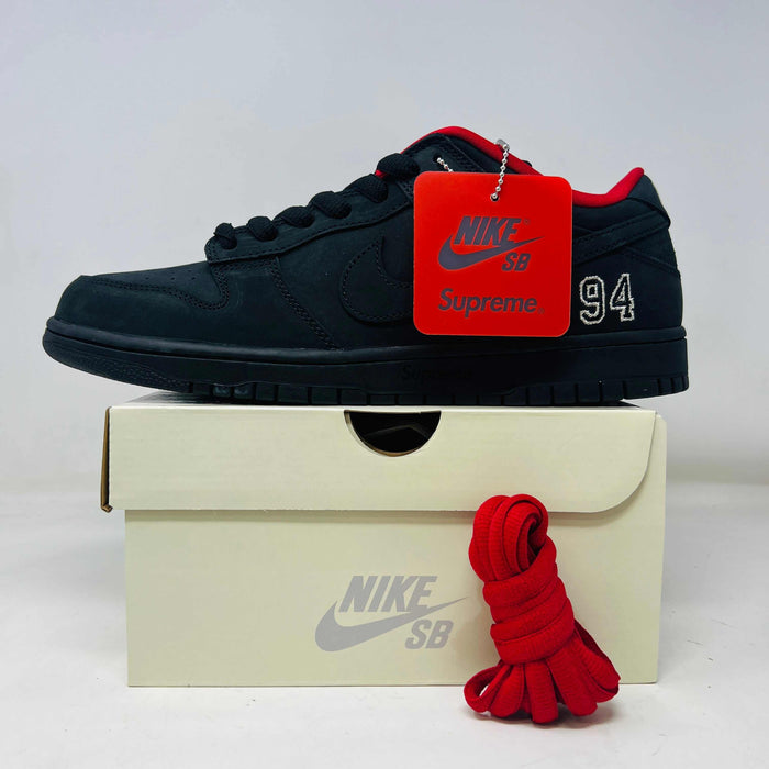Nike SB Dunk Low Supreme 94 Black sneaker with red details on box and extra red laces.