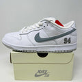 Nike SB Dunk Low Supreme 94 sneaker in white with metallic silver swoosh and number 94 detail on box