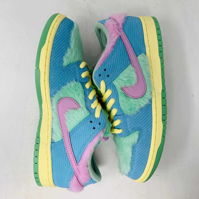 Brand new Nike SB Dunk Low Verdy Visty sneakers with blue, green, and pink fuzzy textures showcase pink swooshes, yellow laces, and green soles against a light gray background.