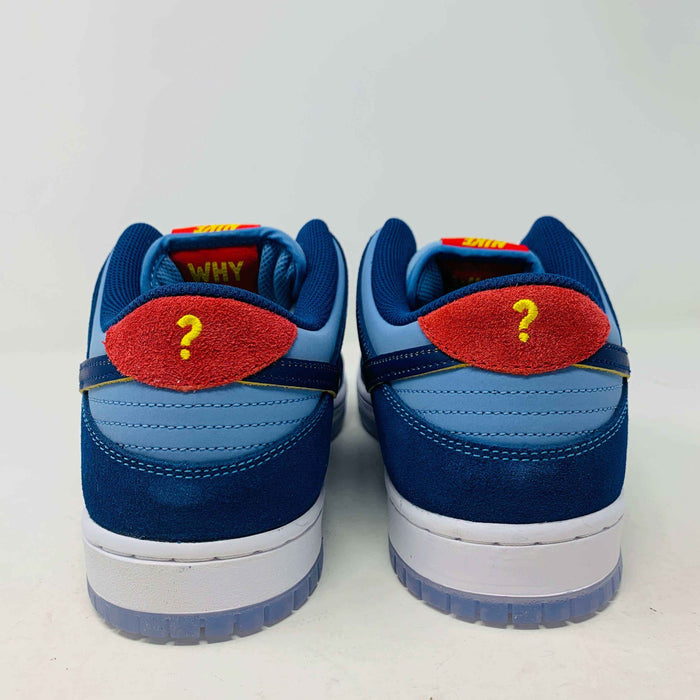 Nike SB Dunk Low "Why So Sad?" sneakers, rear view showcasing unique red and blue design with question mark detail.