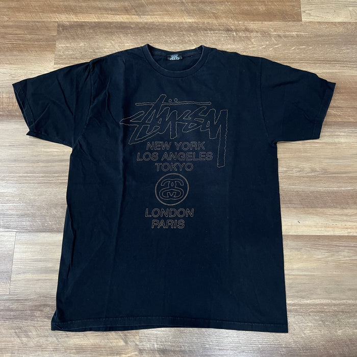 Stüssy World Tour T-shirt black with gold/tan