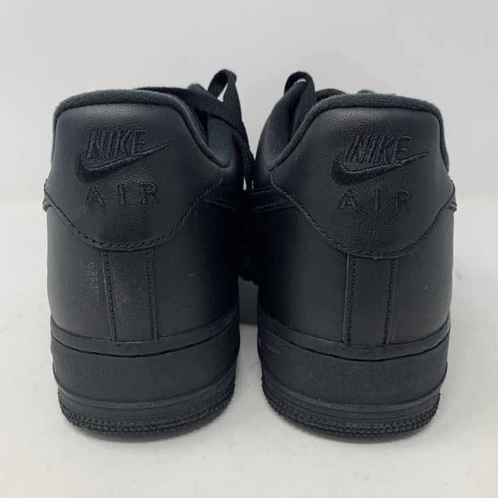 The Nike Supreme Air Force 1 Black features a perforated design on the toe box, black supreme laces with a shiny tag, and a prominent Nike logo, all set against a plain white background.