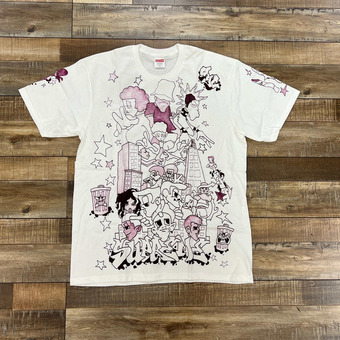 White Supreme Downtown Tee with graphic urban art design and stars on front and sleeves