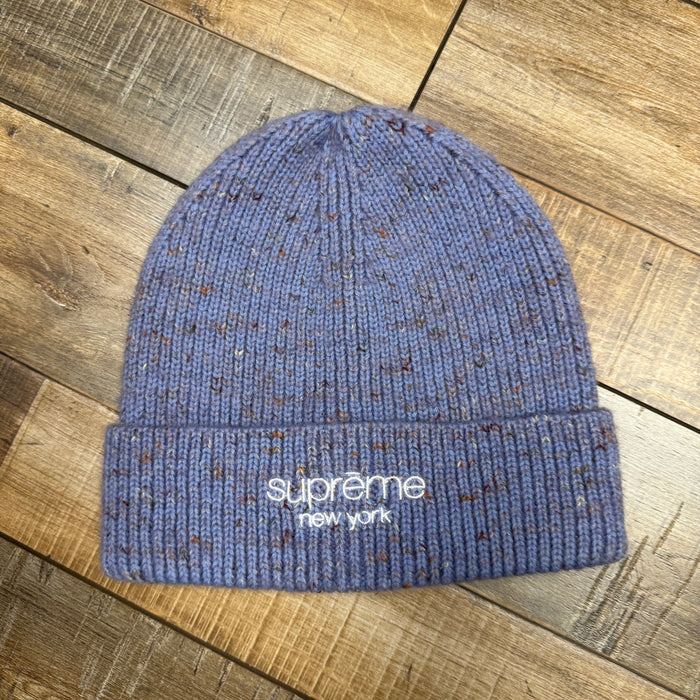 Supreme Rainbow Speckle Beanie in light blue, brand new condition, featuring multicolor speckles.