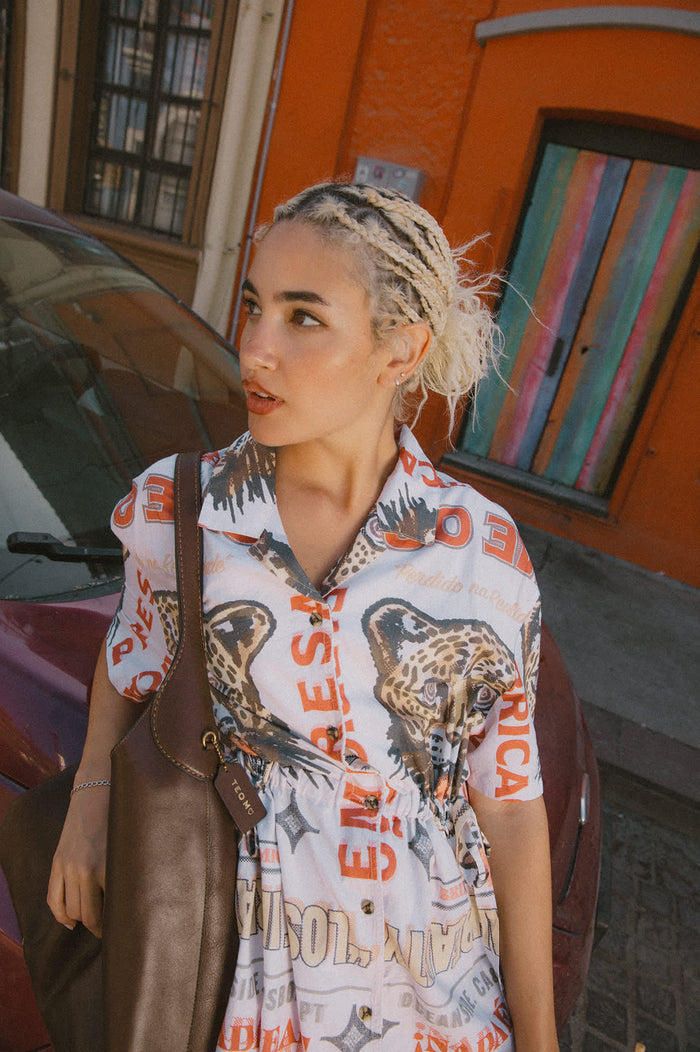 Women's The Cinch Button Down Short Sleeve Dress in the color Lost In Reality Print - Men's Lifestyle image