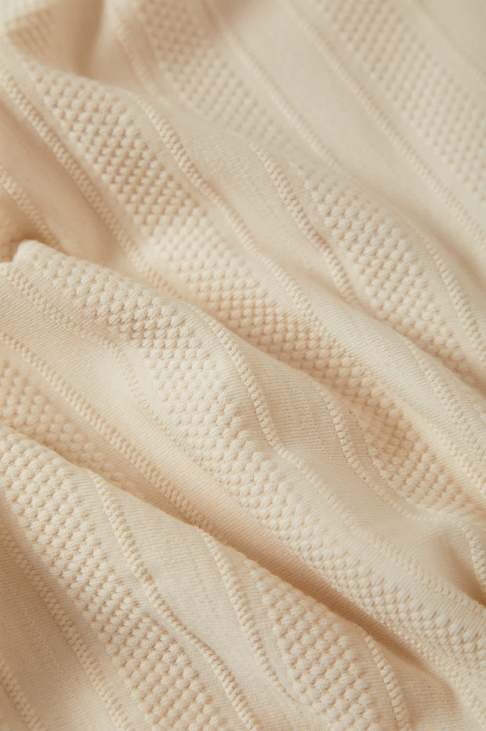 Men's Theo Jacquard Short Sleeve Polo in the color Cream - Additional Laydown image