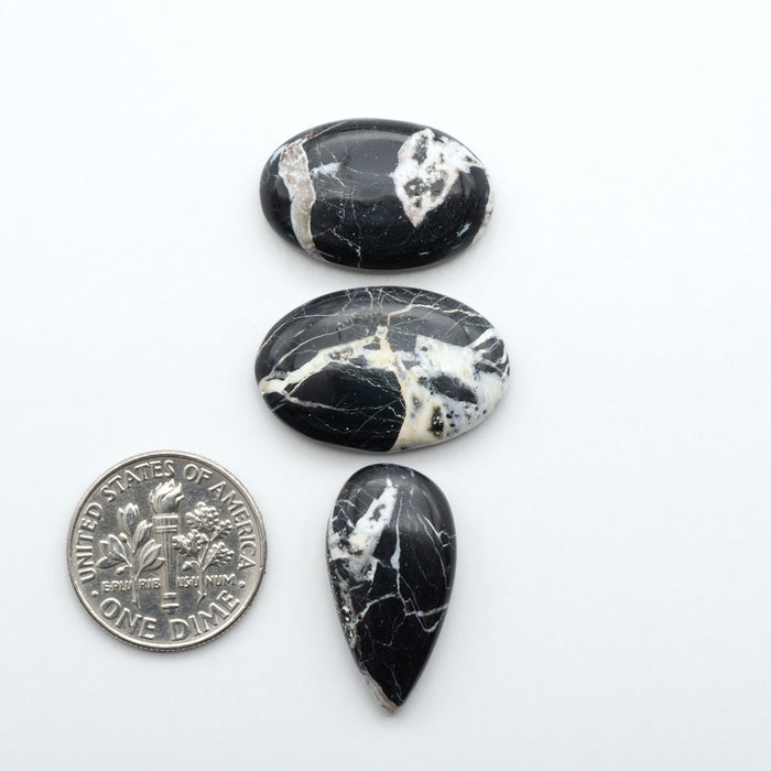 Natural White Buffalo Stone Cabochons are semi-precious gemstones cut into shapes ideal for jewelry-making, making them an excellent choice for artisans.