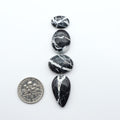 Natural White Buffalo Stone Cabochons are semi-precious gemstones cut into shapes ideal for jewelry-making, making them an excellent choice for artisans.