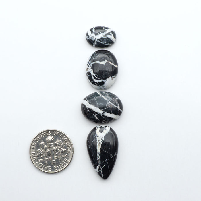 Natural White Buffalo Stone Cabochons are semi-precious gemstones cut into shapes ideal for jewelry-making, making them an excellent choice for artisans.