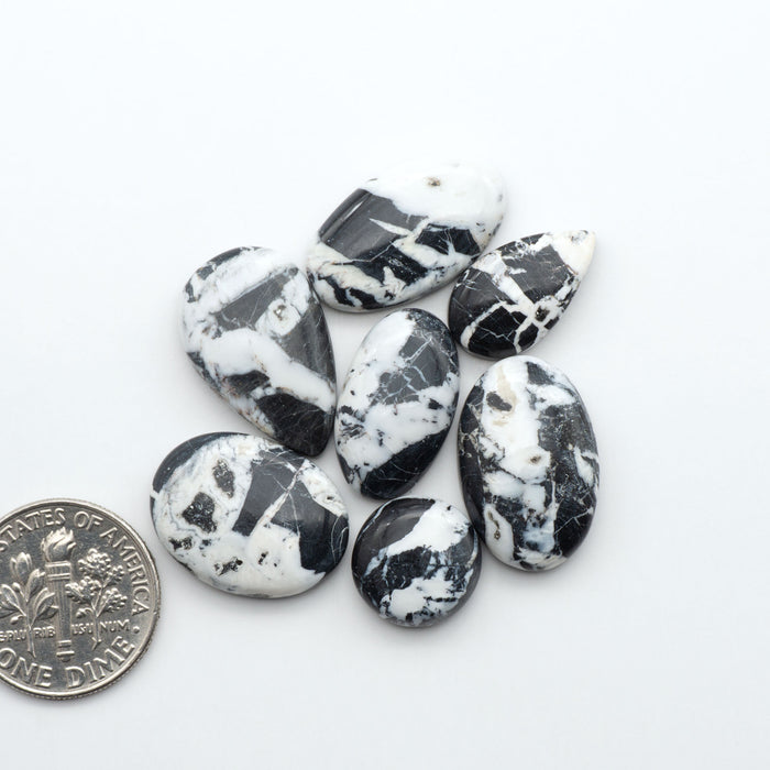 Natural White Buffalo Stone Cabochons are semi-precious gemstones cut into shapes ideal for jewelry-making, making them an excellent choice for artisans.