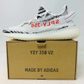 Brand new Yeezy 350 V2 Zebra sneaker with iconic zebra pattern and Boost cushioning in original box