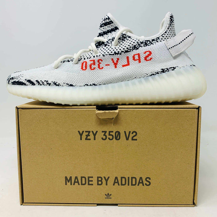 Brand new Yeezy 350 V2 Zebra sneaker with iconic zebra pattern and Boost cushioning in original box