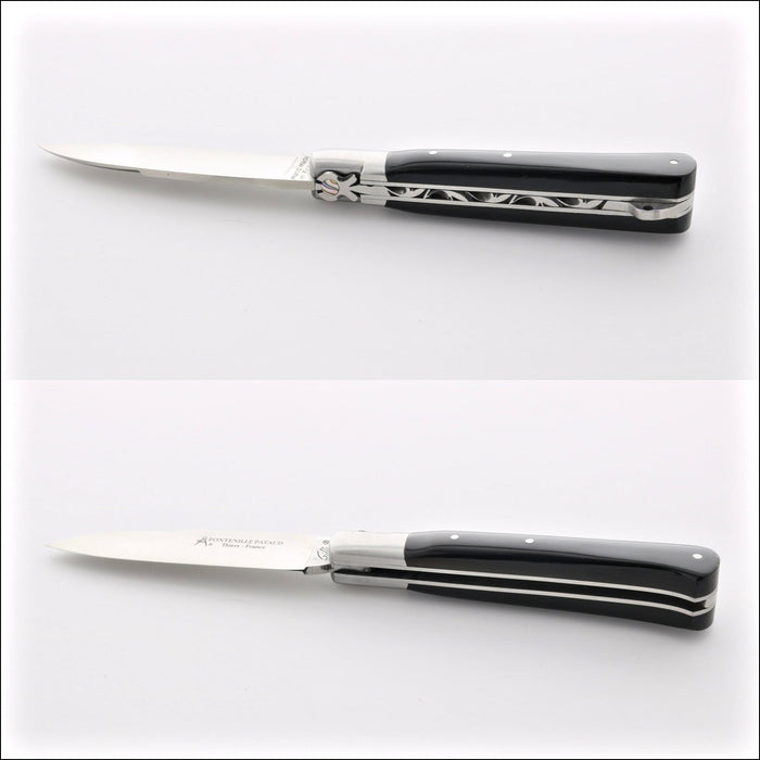 Yssingeaux 11 cm Classic Pocket Knife - Black Horn. Top-down view of the open knife, showing the polished black horn handle and stainless steel blade. Handcrafted details, 100% Made in France.